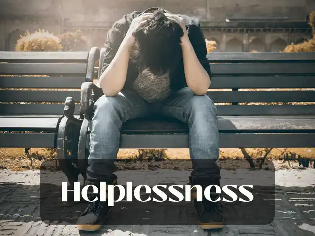 A person sits hunched over on a dark park bench, hands on their head, conveying distress or sadness. The word 'Helplessness' is prominently displayed across the image, with the Lemon8 logo and username '@natasha.ulery' in the bottom left corner.