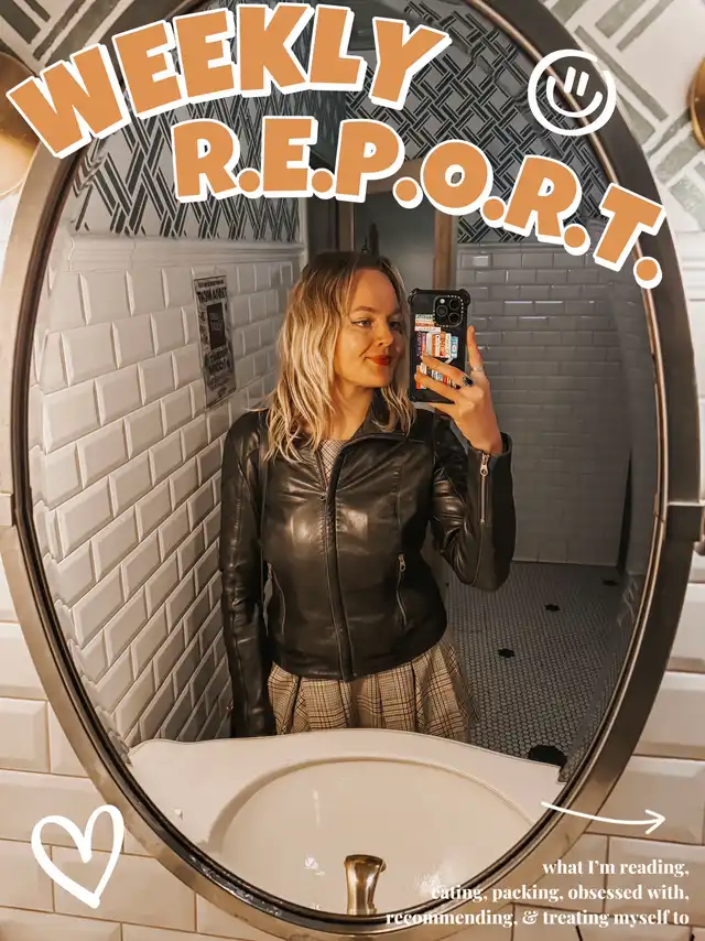 A woman in a black leather jacket and plaid skirt takes a mirror selfie in a restroom, with text overlay 'WEEKLY R.E.P.O.R.T.' and a list of topics: reading, eating, packing, obsessed with, recommending, and treating myself to.