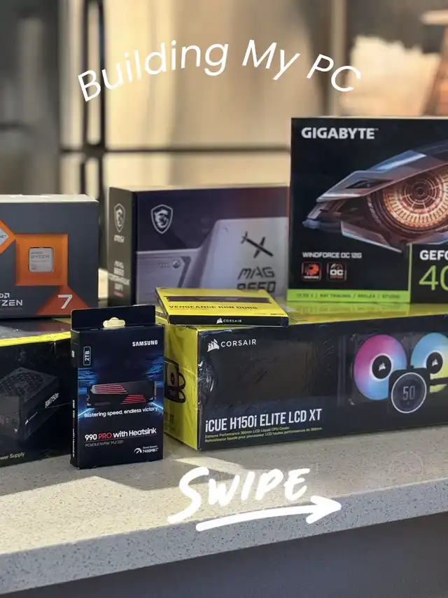 A collection of various computer component boxes, including a processor, graphics card, memory, and cooler, laid out on a counter for a PC build.